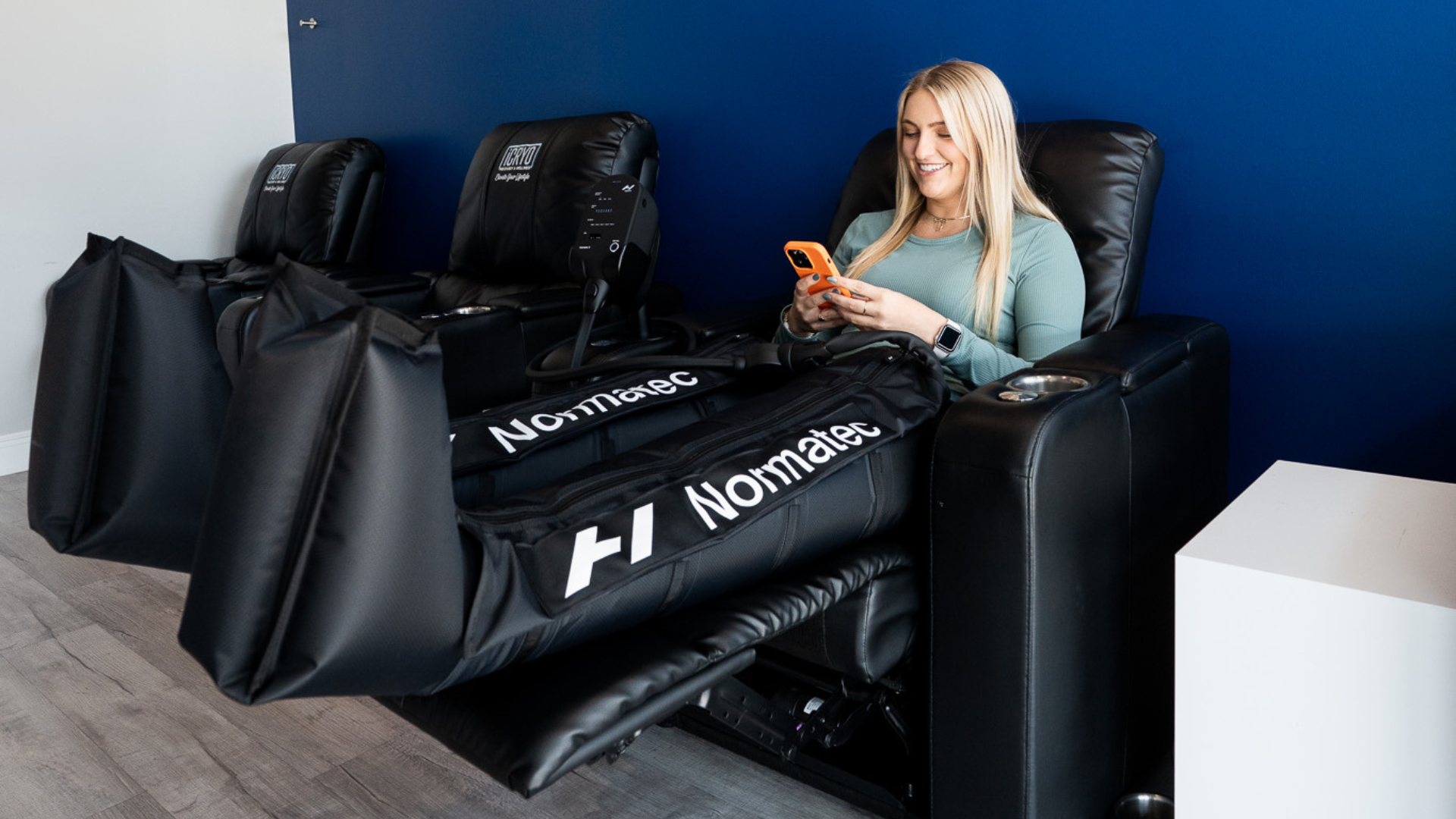 Athlete using compression therapy boots for recovery